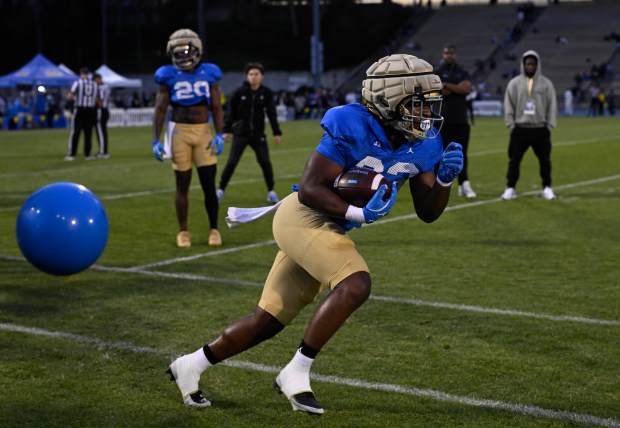 Karson Cox #33 of the UCLA Bruins during UCLA football...