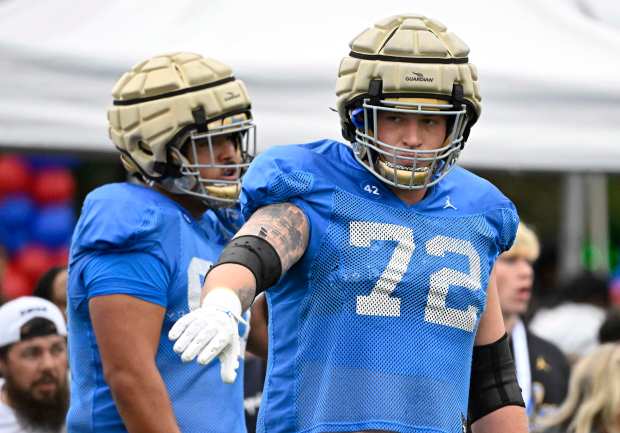 Offensive lineman Garrett DiGiorgio #72 of the UCLA Bruins during...