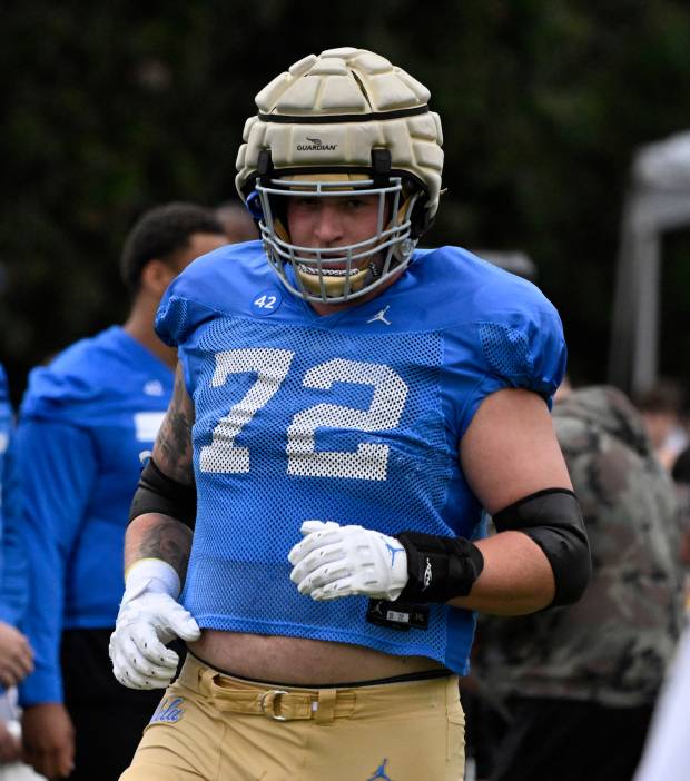 Offensive lineman Garrett DiGiorgio #72 of the UCLA Bruins during...