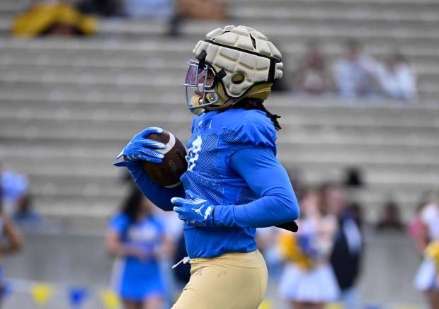 Running back Jalen Berger #0 of the UCLA Bruins during...