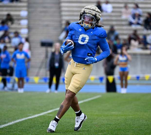 Running back Jalen Berger #0 of the UCLA Bruins during...