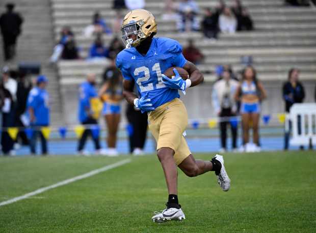 Wide receiver Ezavier Staples #21 of the UCLA Bruins during...