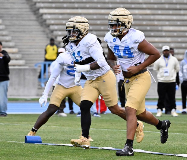 Defensive back Nico Davillier #11 of the UCLA Bruins during...
