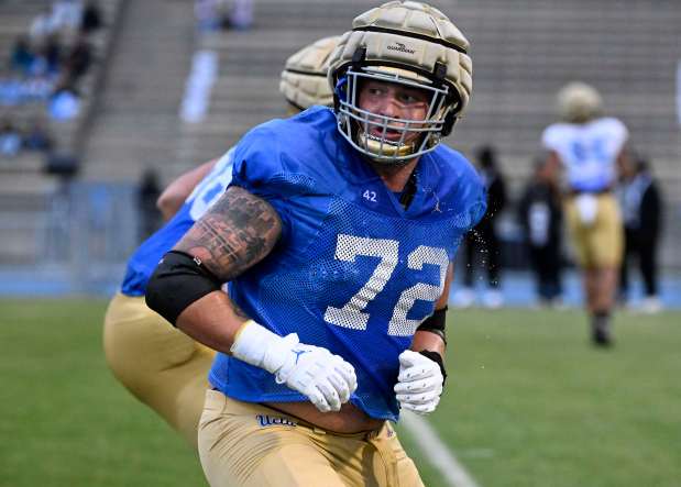 Offensive lineman Garrett DiGiorgio #72 of the UCLA Bruins during...