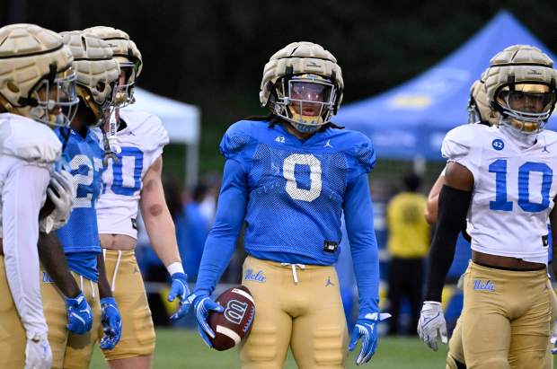 Running back Jalen Berger #0 of the UCLA Bruins during...