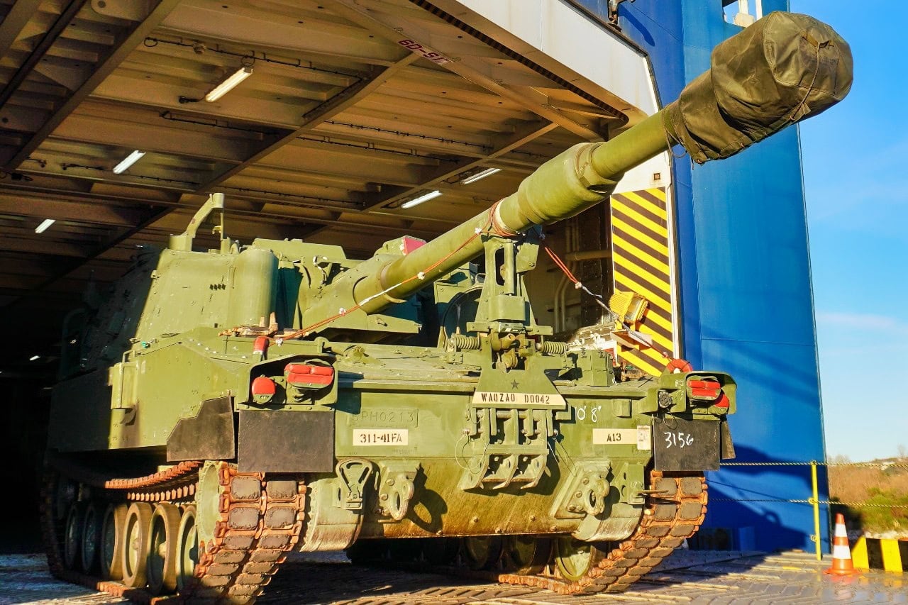 A U.S. M109 Paladin howitzer drives off the vessel Liberty Peace during offloading operations at the port of Koper, Slovenia on December 28, 2024. This Reception, Staging, and Onward Movement (RSOM) operation in the port of Koper is bringing in 1-3ID, the next Regionally Aligned Force (RAF), into the European Theater. These forces will be then transported by the 21st Theater Sustainment Command to their forward operating sites across NATO where they will conduct interoperability training with Allies and partners. The intent of these RAFs is to assure our allies and deter all adversaries.