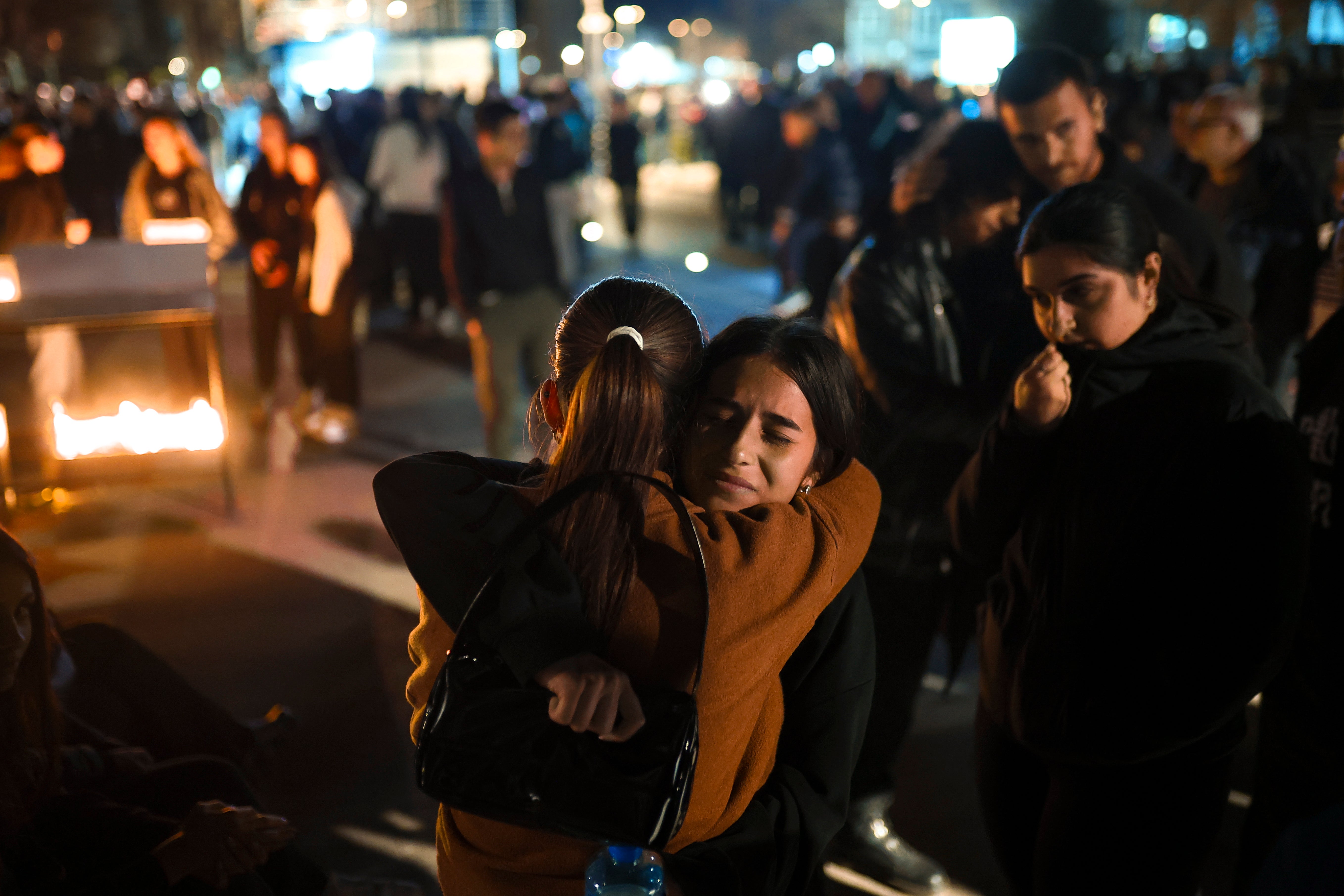 Survivors comfort each other after the blaze