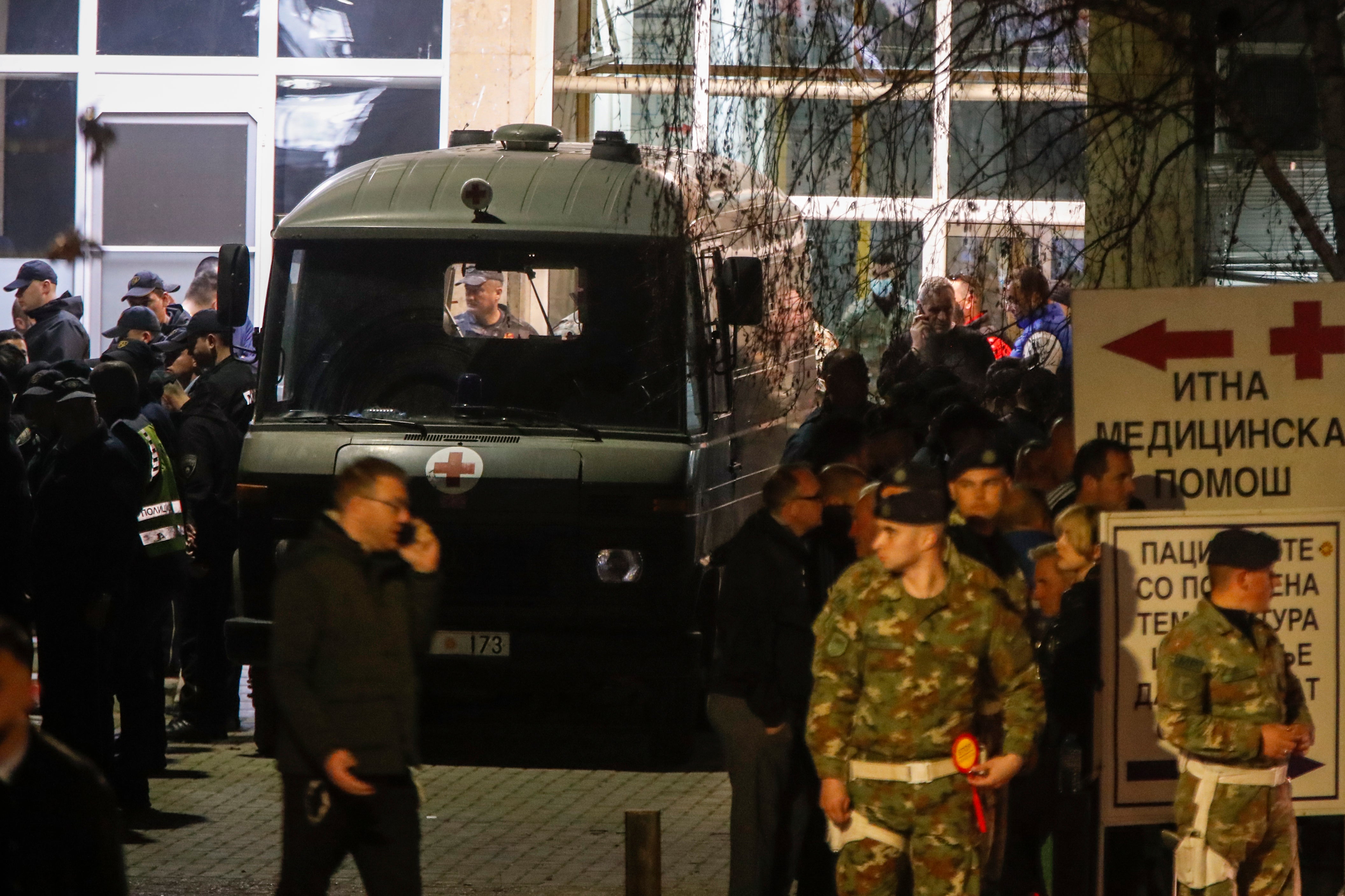 A military ambulance is parked outside a hospital before transporting bodies of victims in the town of Kocani, North Macedonia, Sunday, 16 March 2025
