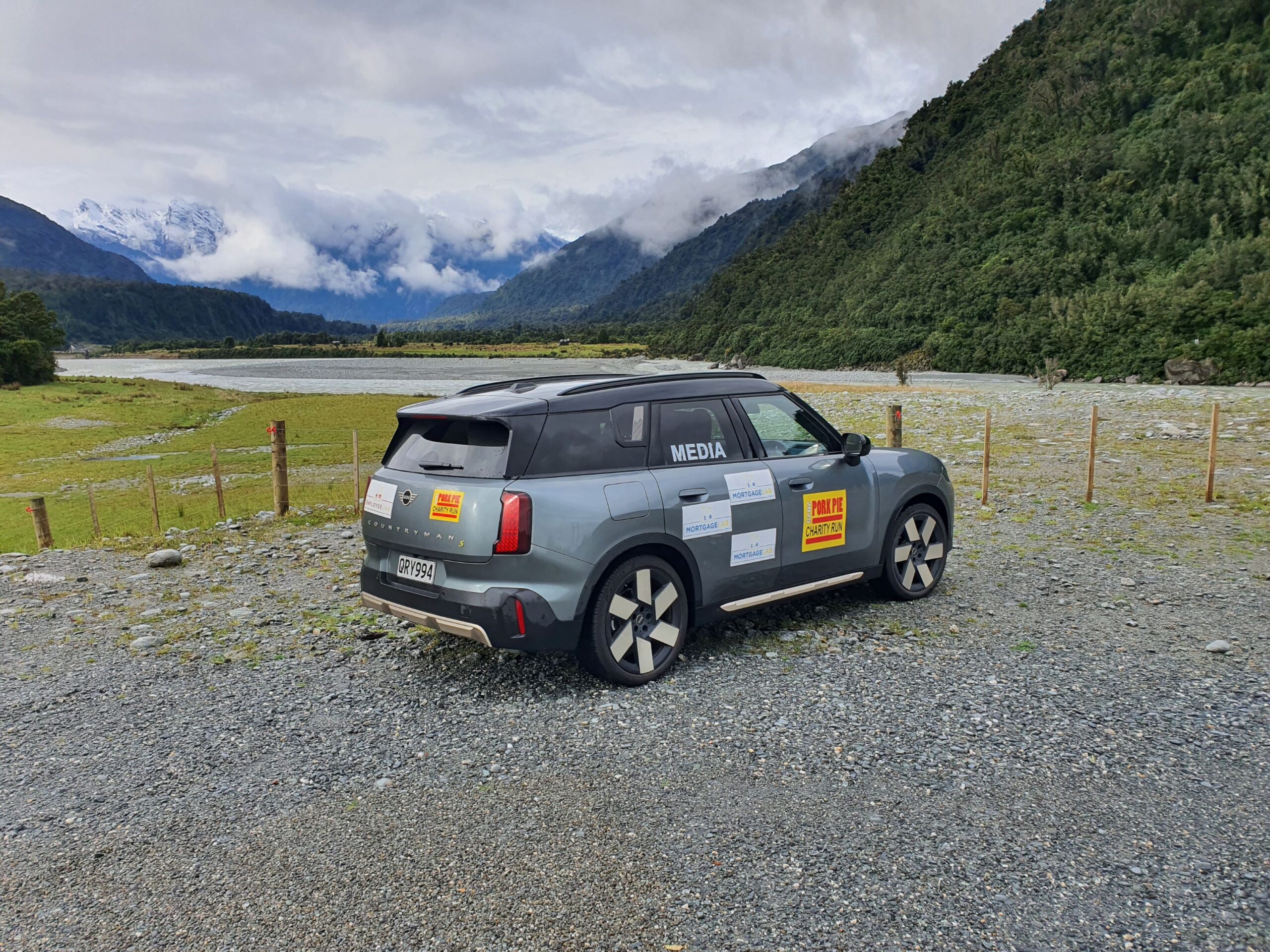 Rear three quarters view of a 2025 Mini Countryman SE All4 with the Southern Alps in the background on the 2025 Pork Pie Charity Run.