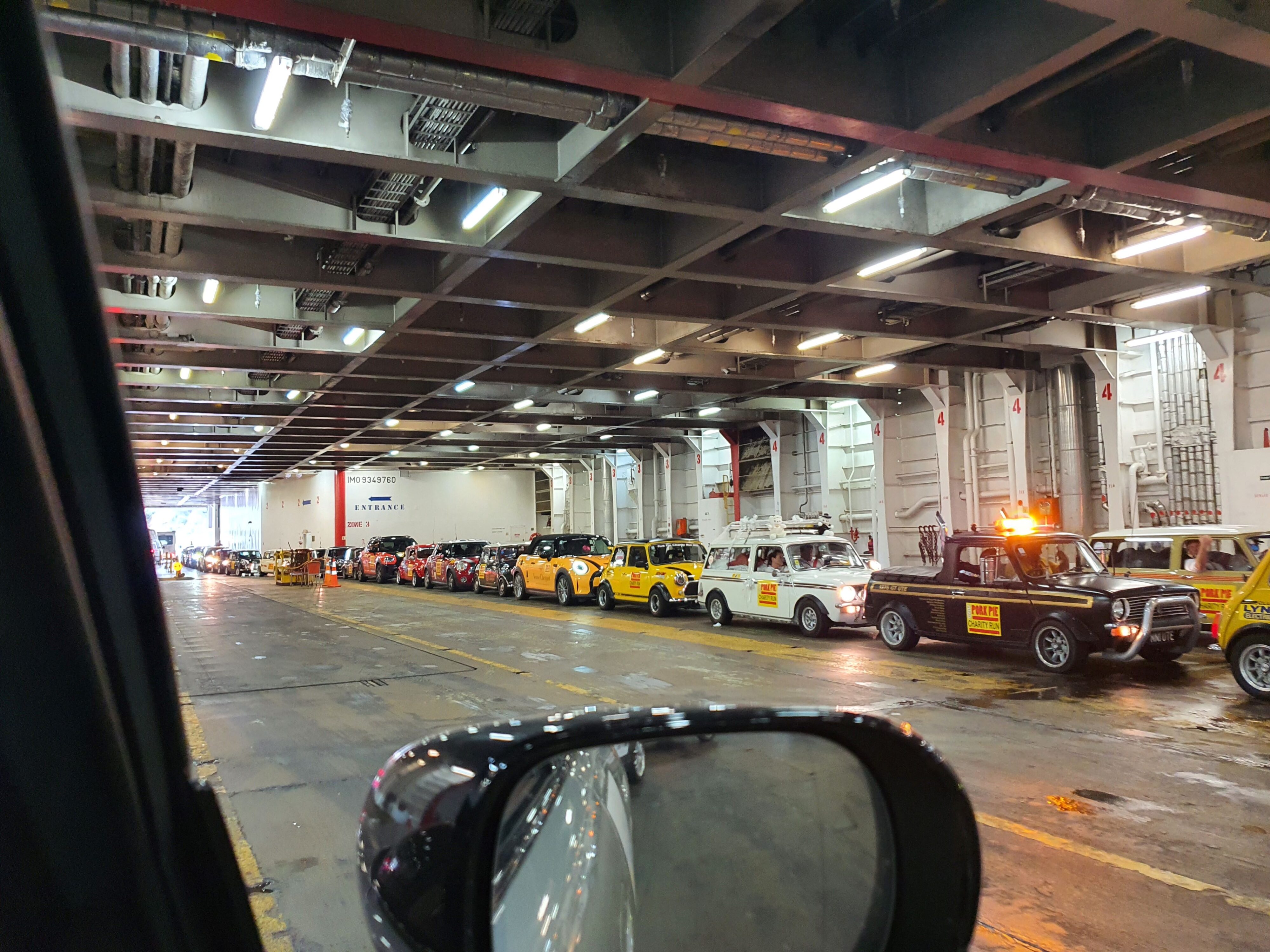 A line of Minis wait to disembark the Bluebridge Cook Strait Ferry at Picton on the 2025 Pork Pie Charity Run.