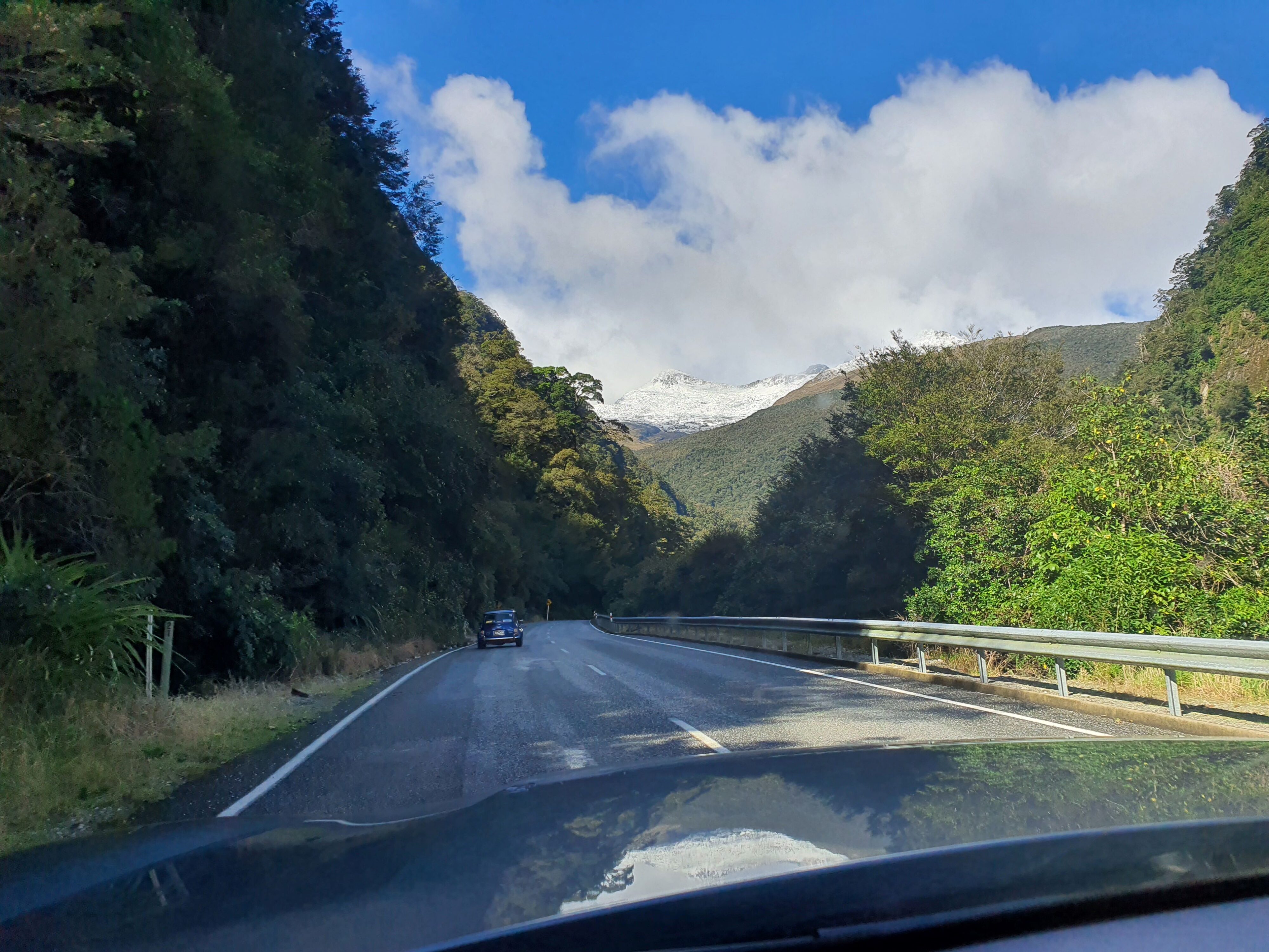 A classic Mini heading towards a backdrop of the Southern Alps on the 2025 Pork Pie Charity Run.