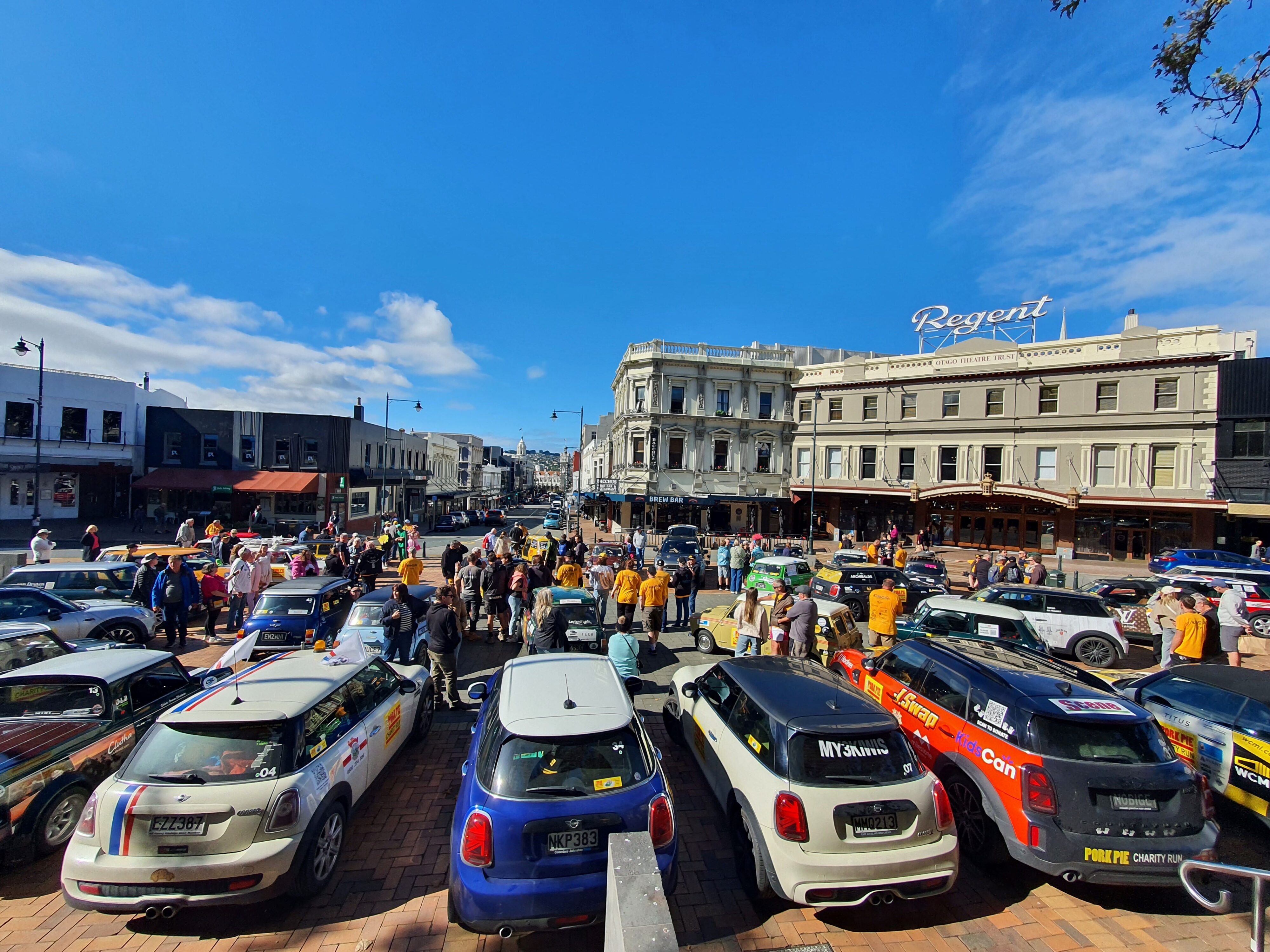 A wide angle photo of Minis gathered in The Octagon, Dunedin on the 2025 Pork Pie Charity Run.