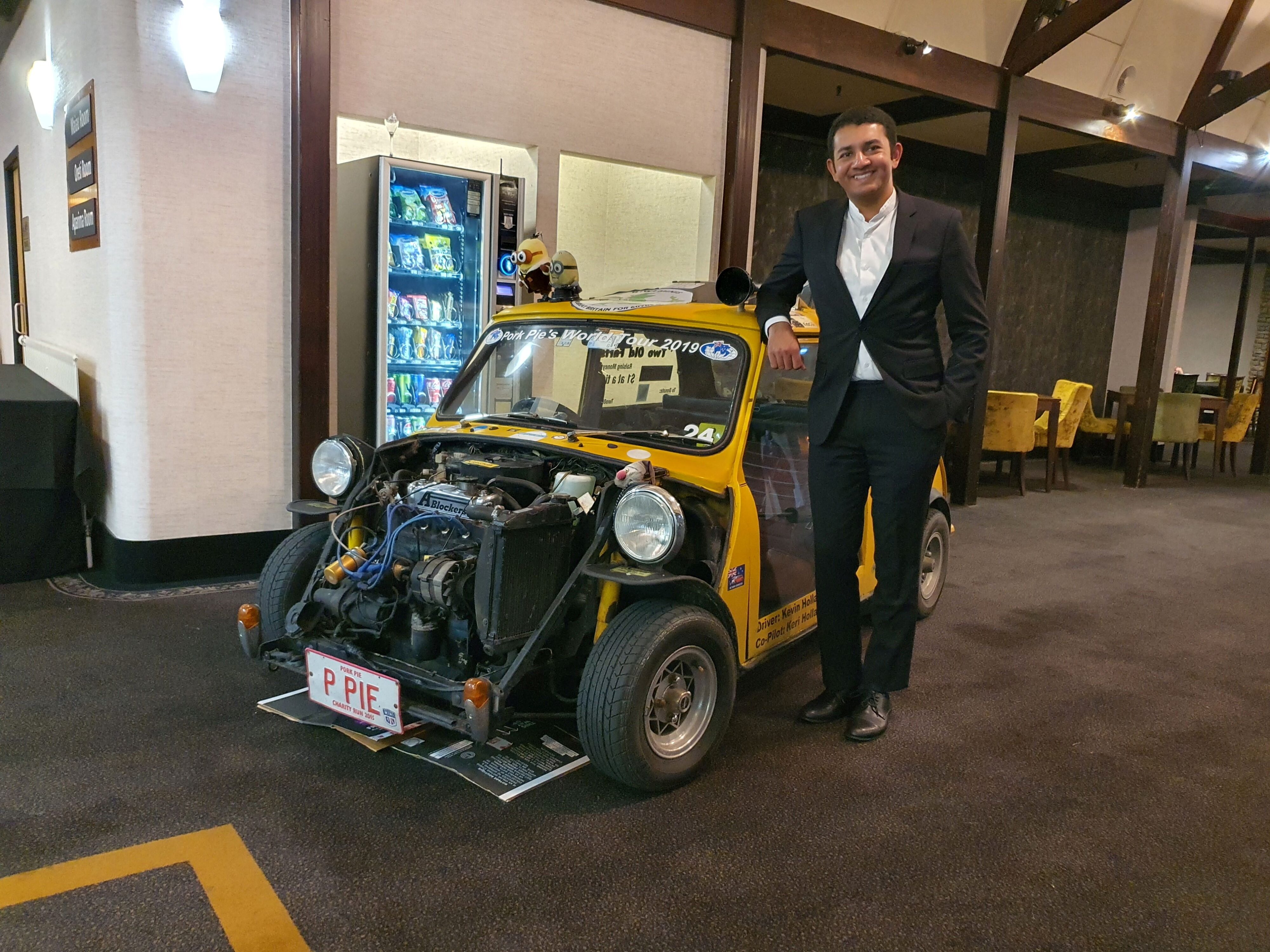 Matthew D'Souza of Tarmac Life pictured with the Mini Pork Pie car at the end of the 2025 Pork Pie Charity Run.
