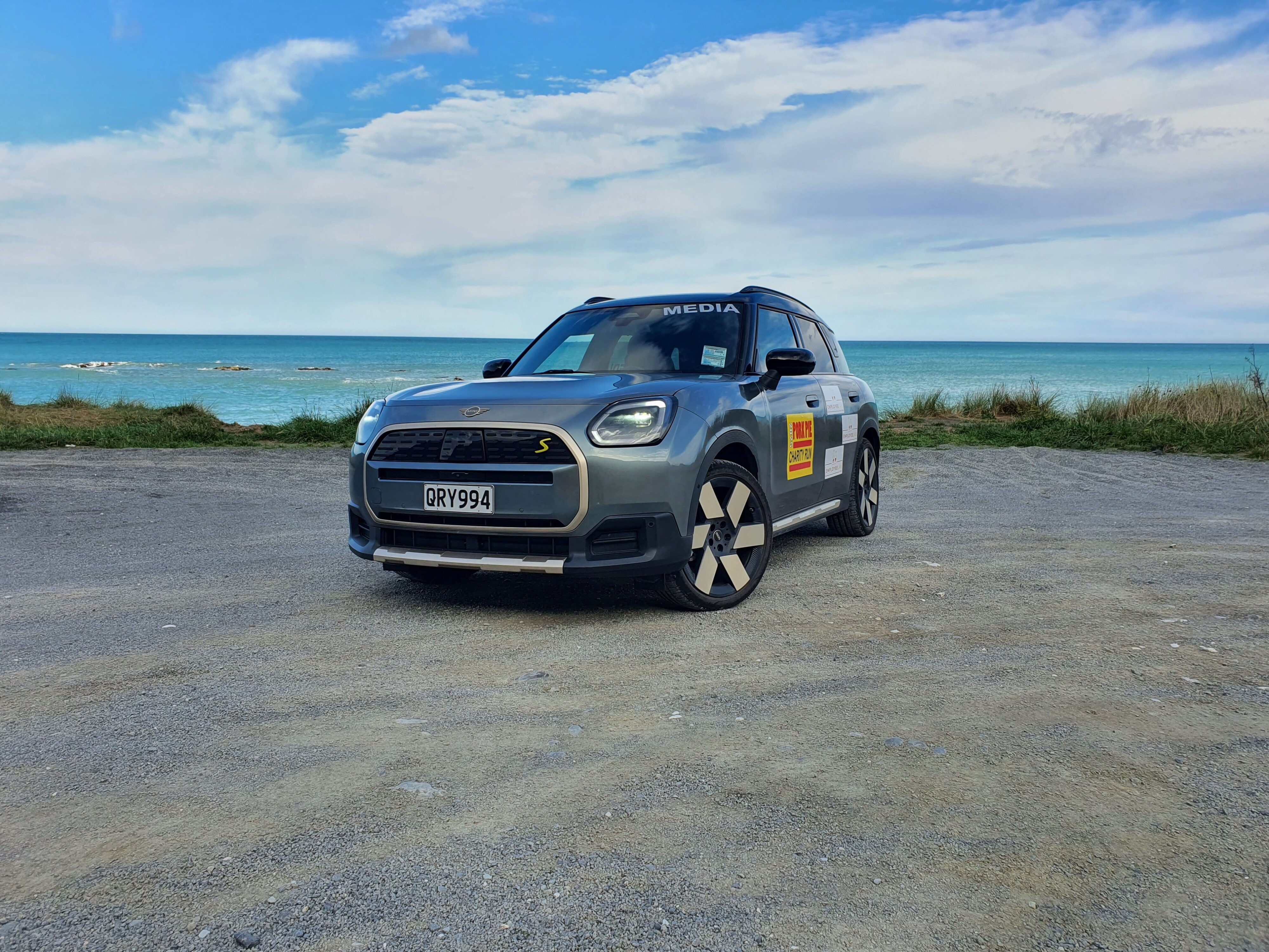 A 2025 Mini Countryman SE All4 with the ocean in the background, taken just outside Kaikoura.