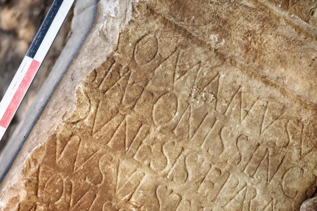 Roman lettering showed the wall stone was once an altar. Credit: Albin Kurti via X