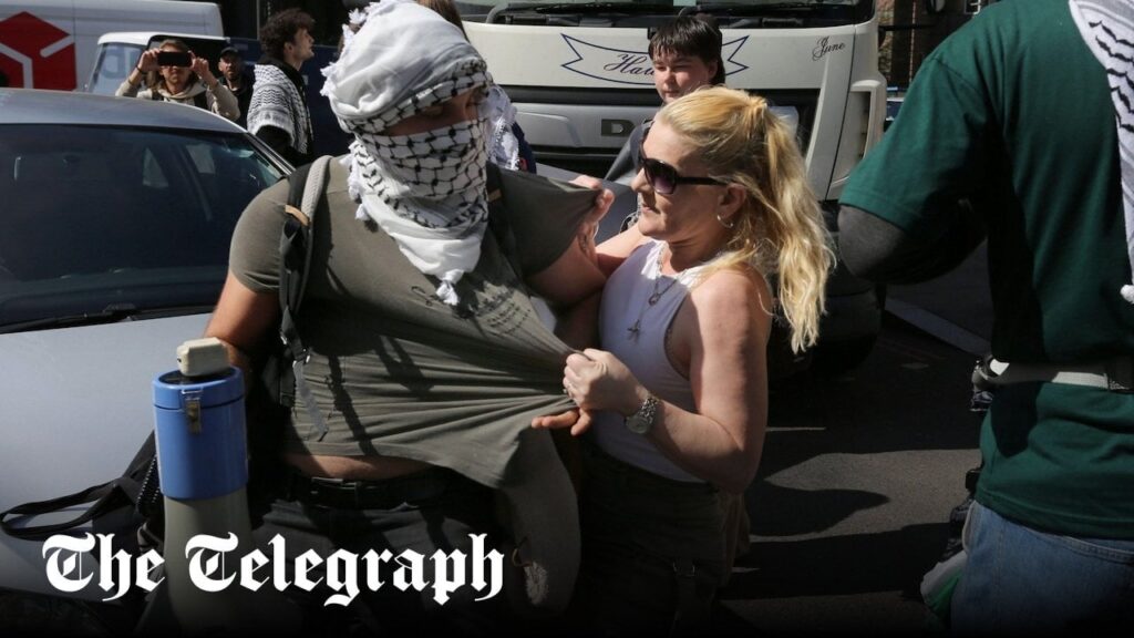 Pro-Palestinian protesters pelted with eggs while blocking traffic