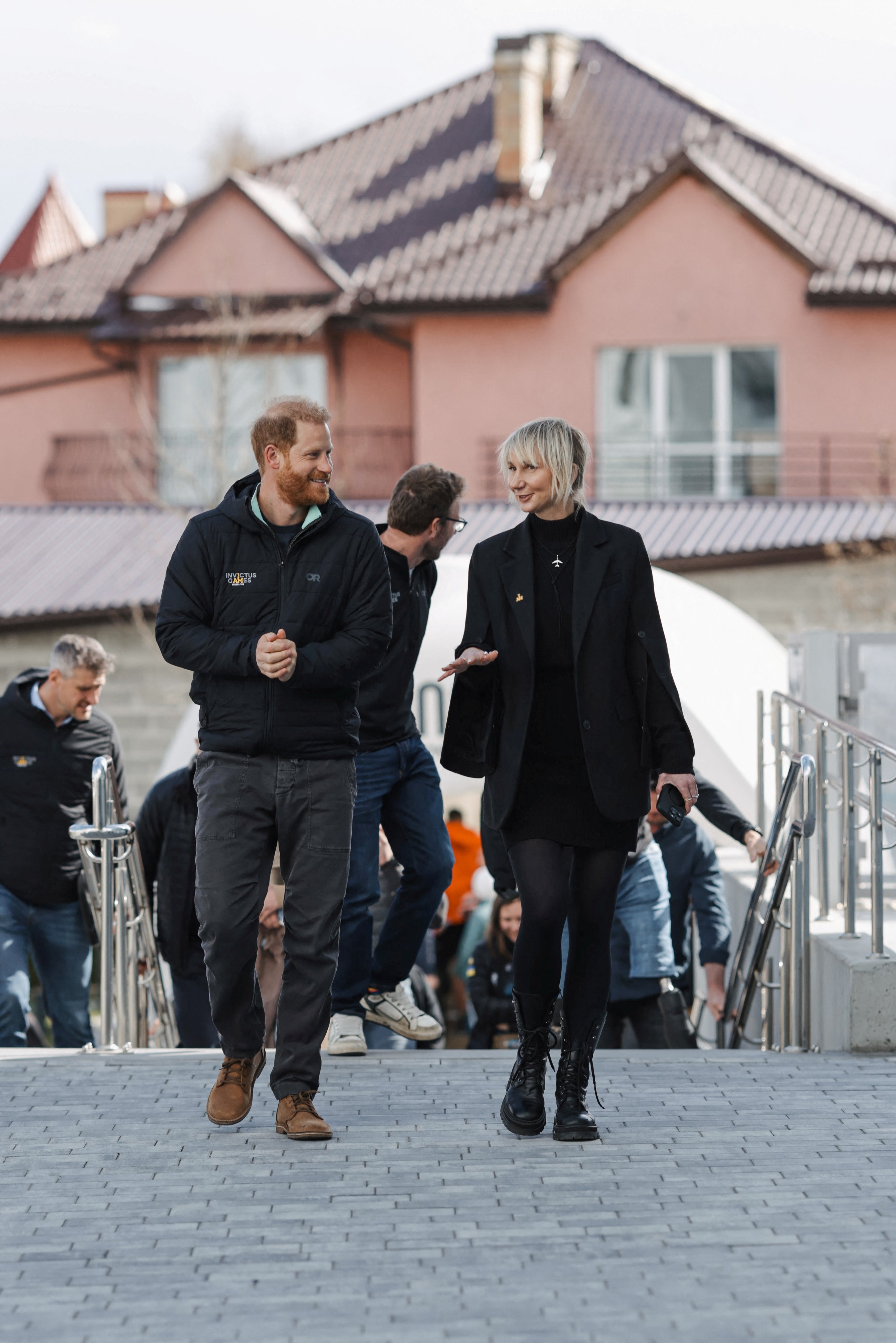 Prince Harry walks with Superhumans Centre CEO Olga Rudneva as he visits Lviv