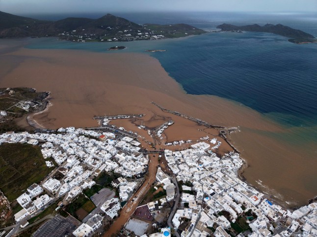 An aerial photograph shows the port of Naousa, after a powerful storm which has triggered widespread flooding on the Aegean Sea island of Paros, Greece, Monday, March 31, 2025. (AP Photo/Stathis Roussos)