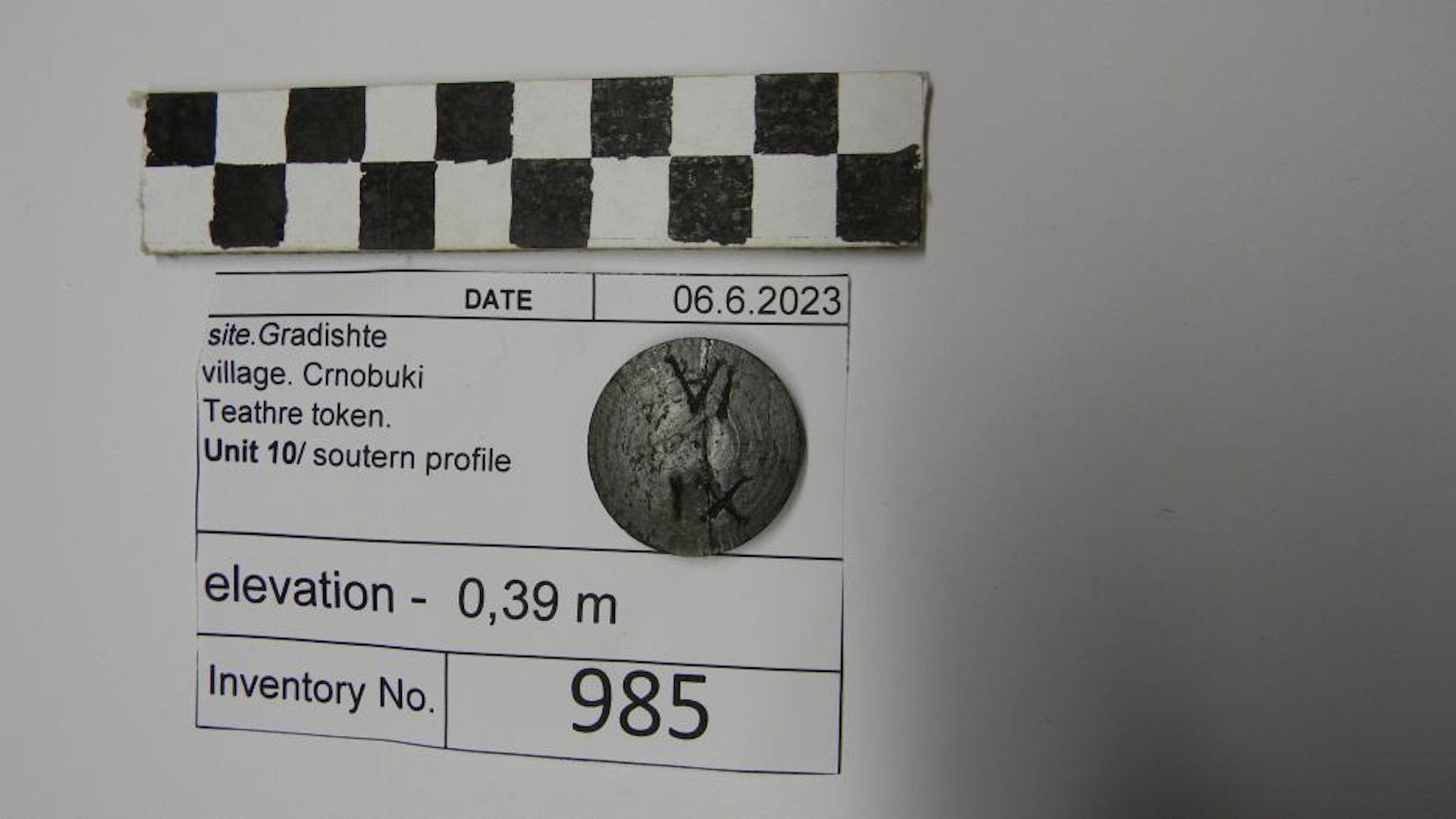 a close-up of a ceramic token