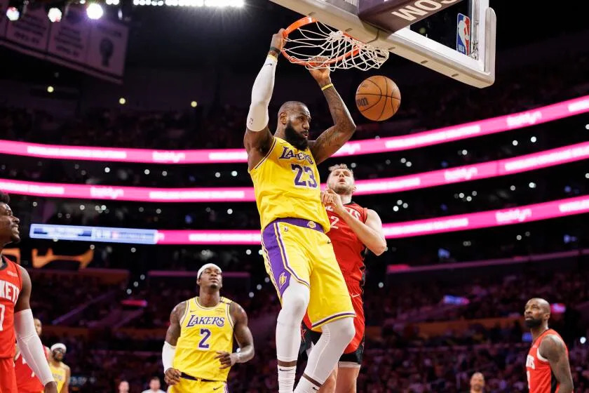 LOS ANGELES, CA - APRIL 11, 2025: Los Angeles Lakers forward LeBron James (23) slam dunks.