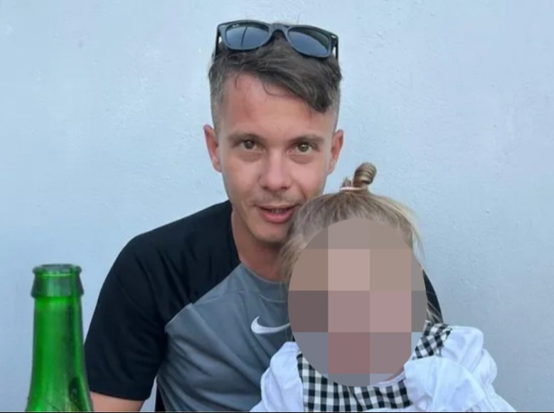 Man holding a young child.
