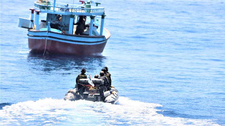 Crew from INS Tarkash conducts a boarding of the suspicious dhow.