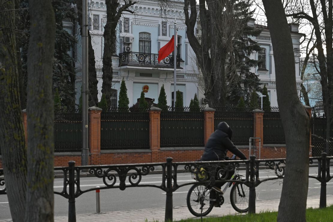 A man cycles past the Chinese embassy in Kyiv, Ukraine on April 8.