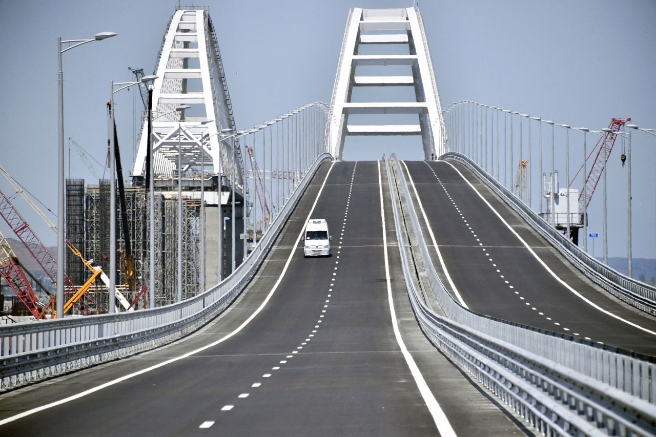 A vehicle drives over the Crimean Bridge, which passes over the Kerch Strait and links southern Russia to the Crimean peninsula, in May 2018.