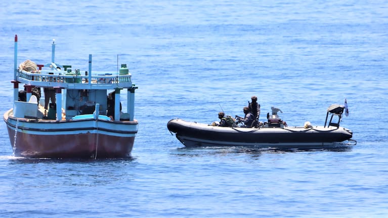 INS Tarkash crew approach a suspicious dhow.