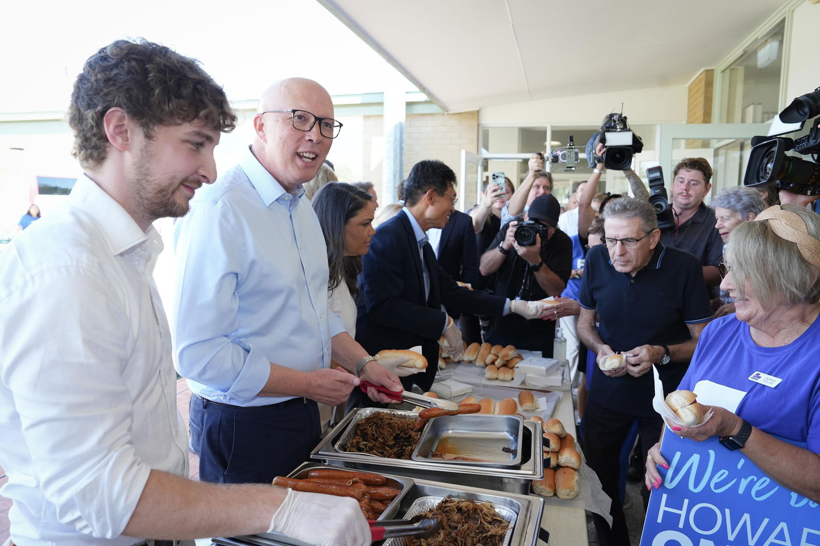 Peter Dutton serves sausages 