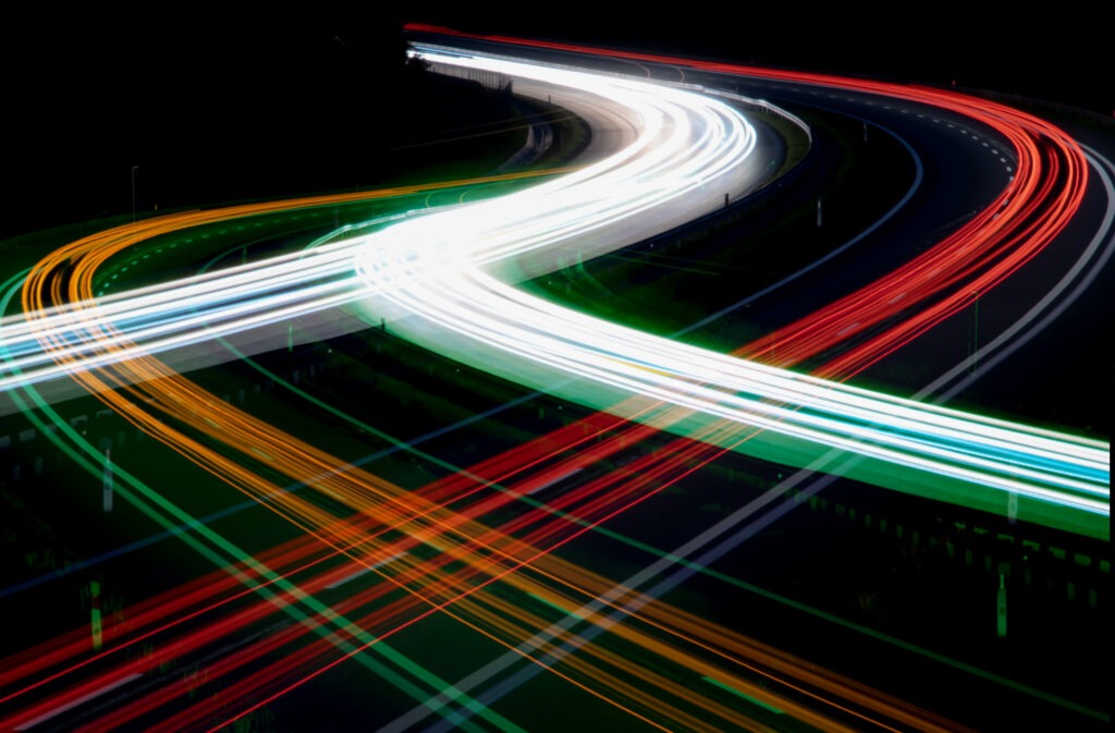 cars on a road at night