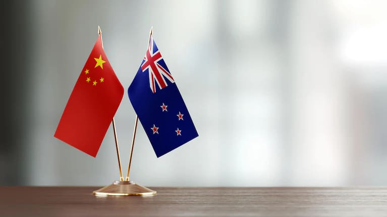 New Zealand and China's flags.
