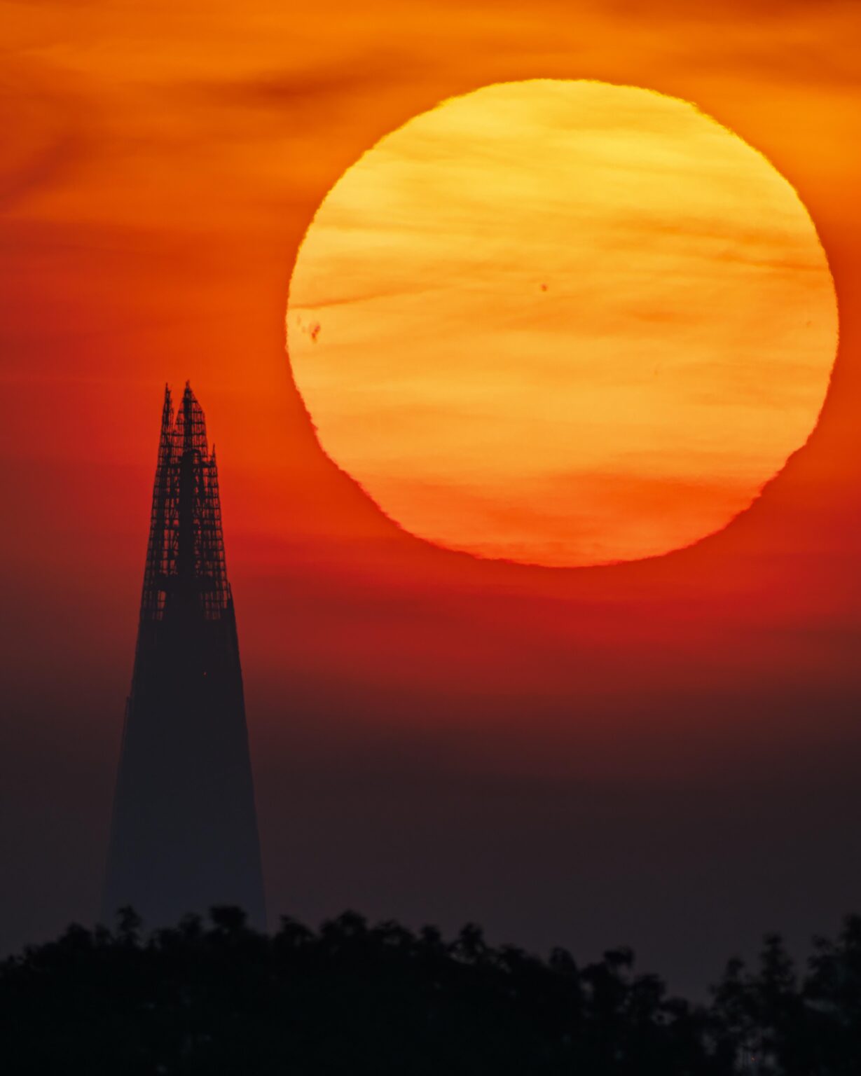 The sun rising next to the shard this morning, London