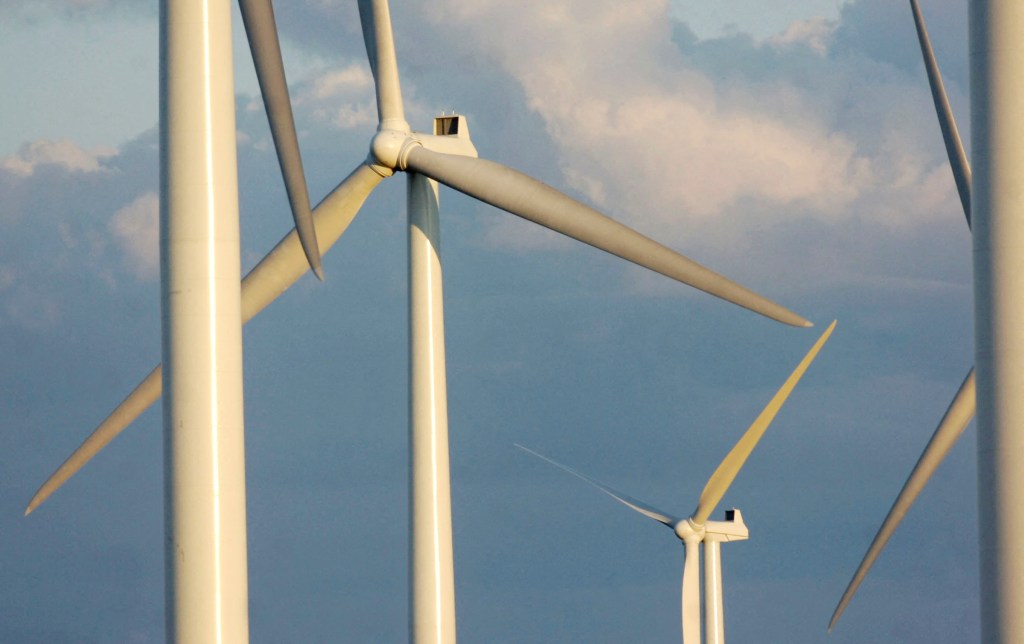 Wind turbines standing tall on a farm in Lowville, New York, August 24, 2006.