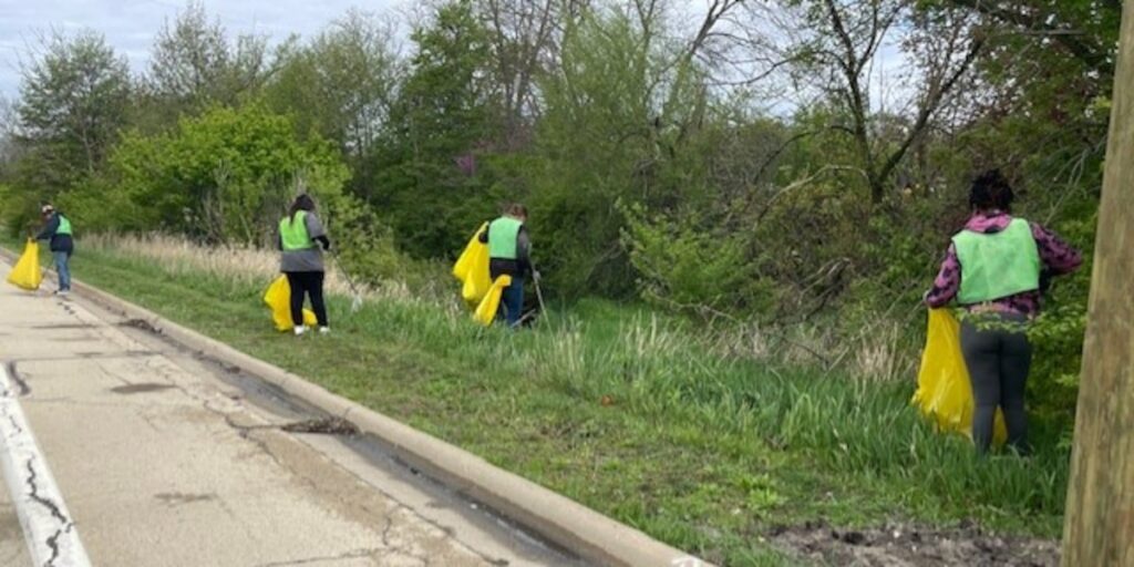Volunteers help the environment by cleaning up along Keith Creek