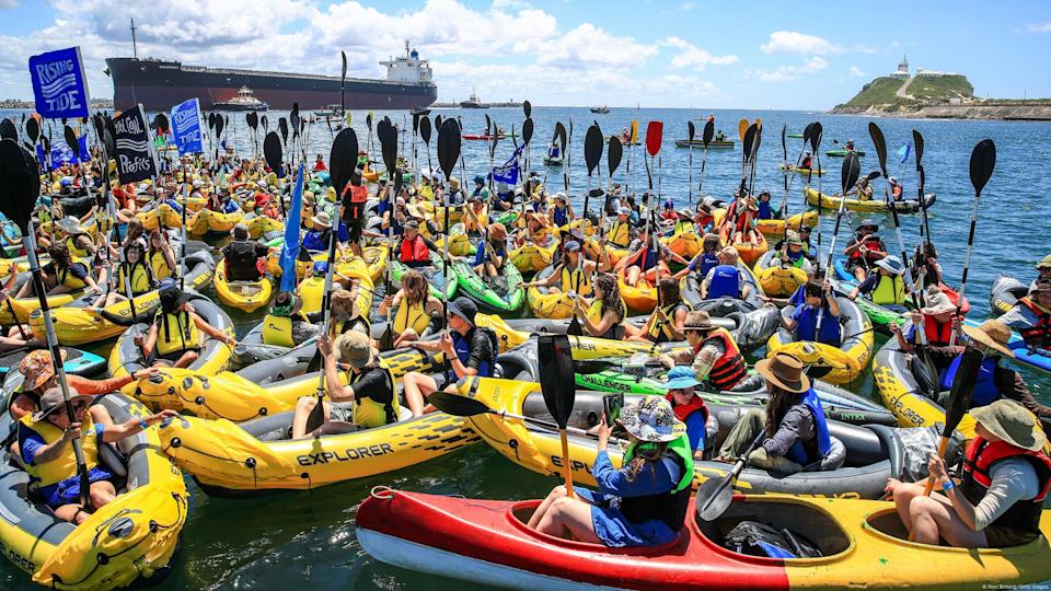 Climate protesters took to the water to blockade the Newcastle coal port, the world's largest, late last year<span class="copyright">Roni Bintang/Getty Images</span>