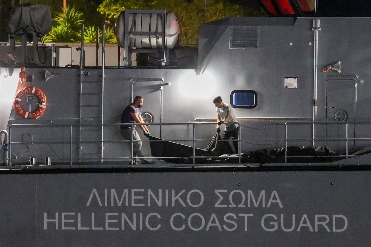 Greek Court Charges 17 Coast Guard Officers Over 2023 Migrant Shipwreck Body bags carrying migrants retrieved from sea arrive in Kalamata