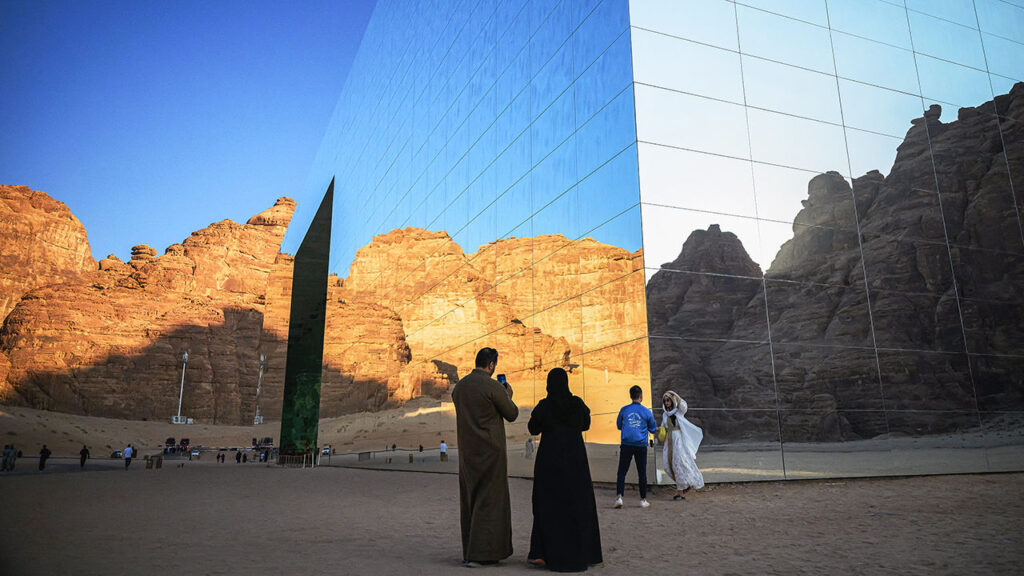Saudi society has changed drastically. Can the economy change, too? Visitors take photographs of the Maraya in Alula, Saudi Arabia