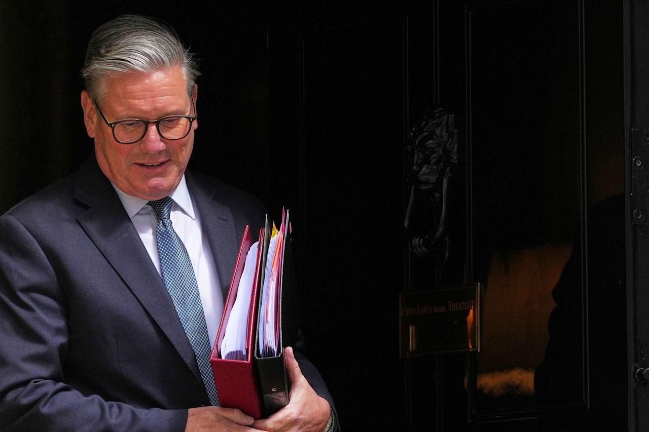 Britain's Prime Minister Keir Starmer leaves 10 Downing Street to attend the weekly session of Prime Minister's Questions in parliament in London, England, Wednesday, May 7, 2025. (AP Photo/Kirsty Wigglesworth)
