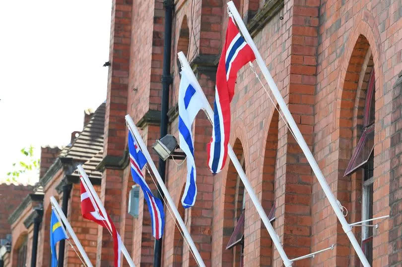Scandinavian flags including the Norwegian flag (far right) outside the Gustav Adolfs Kyrka Scandinavian church