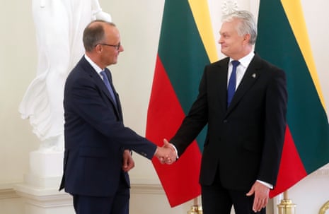 Lithuanian president Gitanas Nauseda (R) and German chancellor Friedrich Merz shake hands during their meeting in Vilnius, Lithuania.