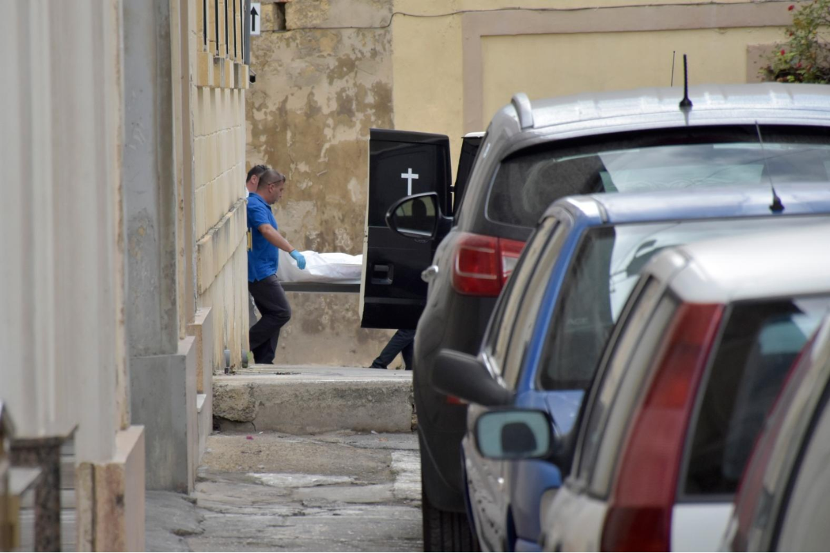 The body of Carmel Chircop is removed after he was murdered in Birkirkara in October 2015. Photo: Times of Malta