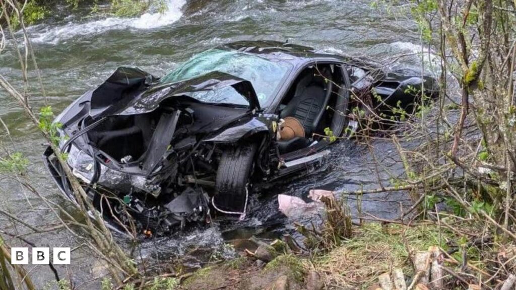 The wreckage of a sports car car that was found plunged into a river in Northern Spain on Sunday