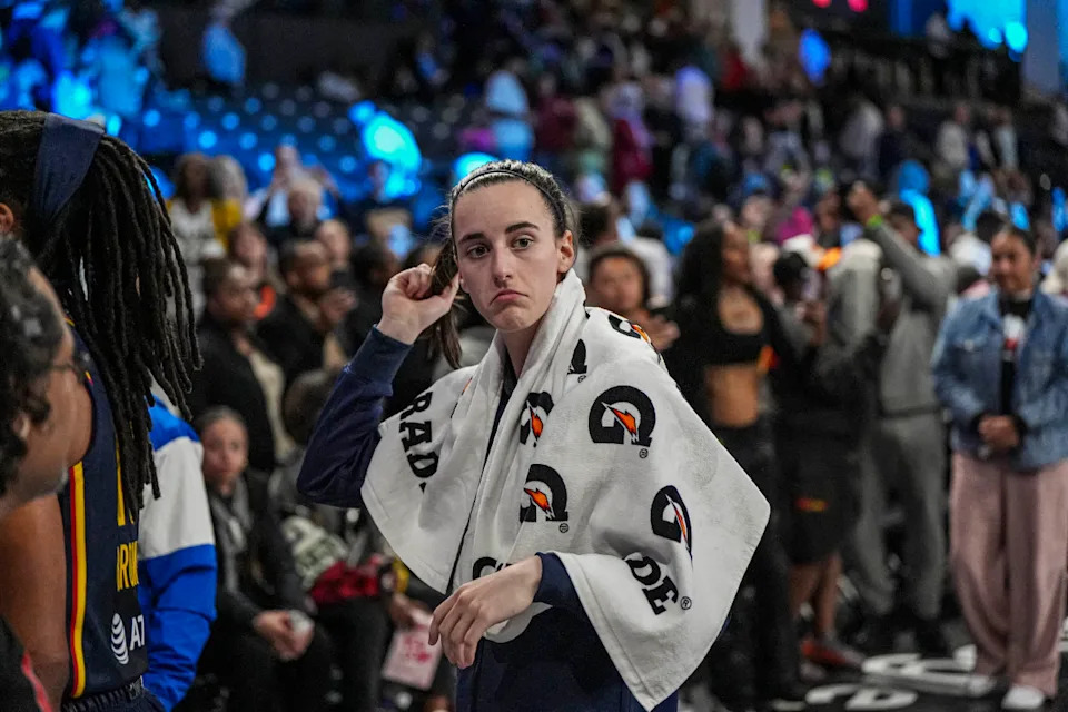Indiana Fever guard Caitlin Clark (22) leaves the court after the Fever defeated the Atlanta Dream at Gateway Center Arena.© Dale Zanine-Imagn Images
