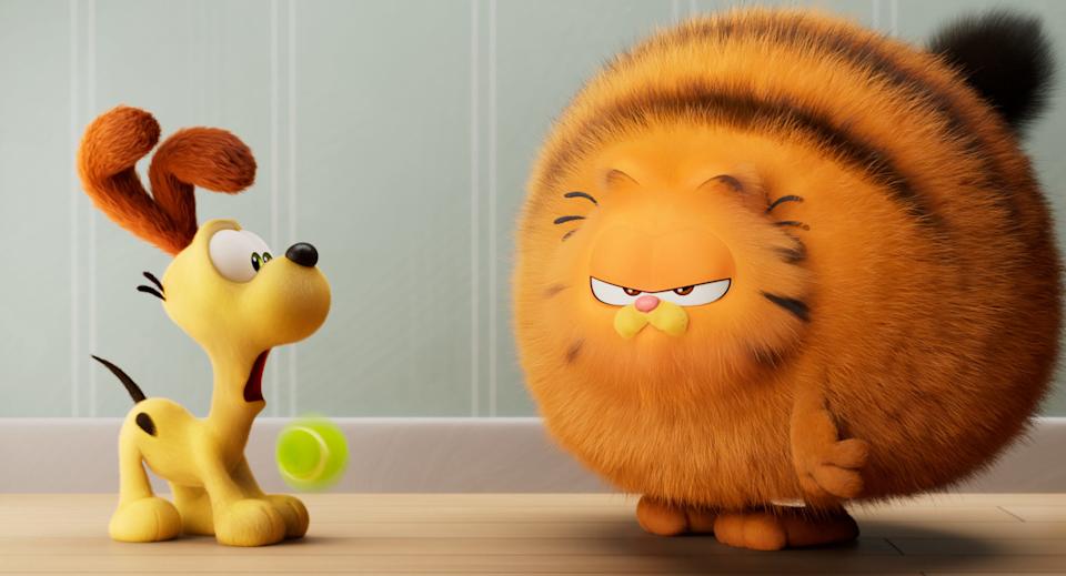 Odie and Garfield are best buds in "The Garfield Movie."