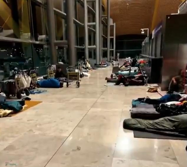 Other images show the airport's dwellers sprawled out along the corridors of the airport
