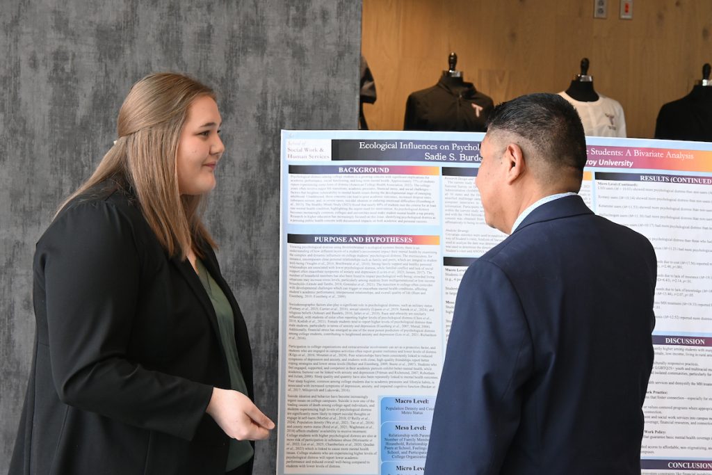 Sadie Burdett speaking with Dr. Boyas about her presentation