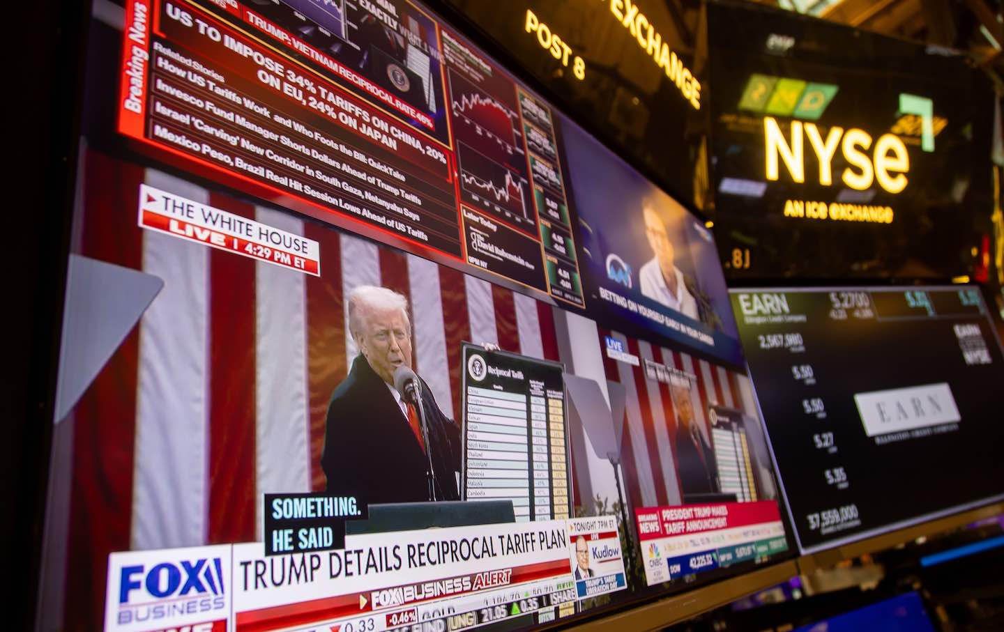 A television station on the floor of the New York Stock Exchange broadcasts Donald Trump announcing tariffs.