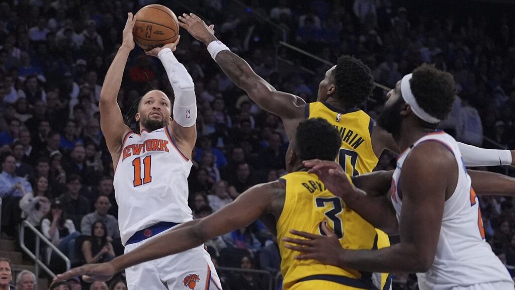 New York Knicks guard Jalen Brunson (11) puts up a shot against the Indiana Pacers during the fourth quarter of Game 1 of the NBA basketball Eastern Conference final, Wednesday, May 21, 2025, in New York. (AP Photo/Frank Franklin II)