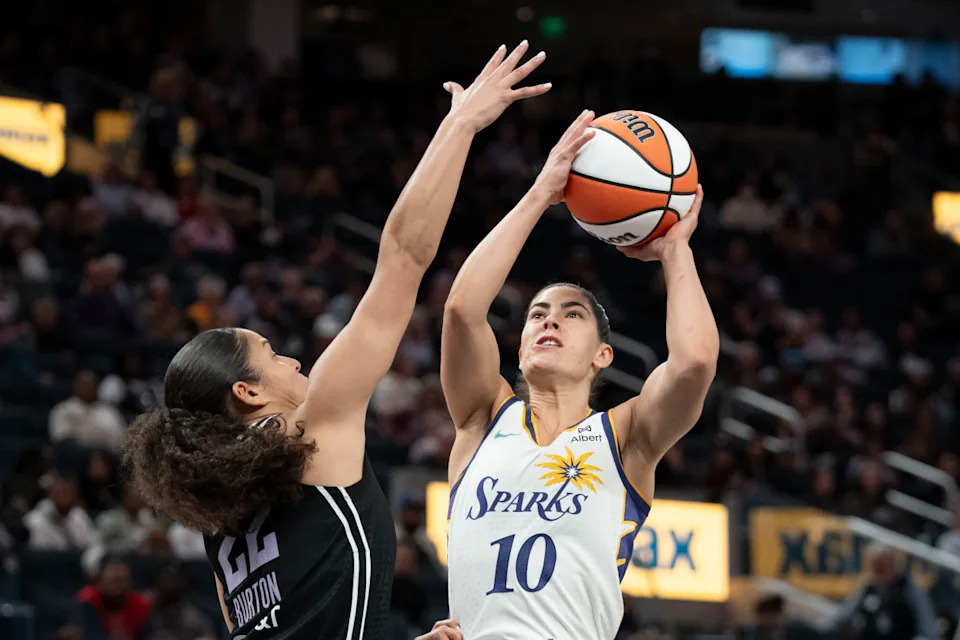 Los Angeles Sparks guard Kelsey Plum shoots against Golden State Valkyries guard Veronica Burton.Kyle Terada-Imagn Images